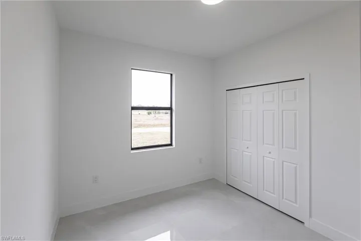 Unfurnished bedroom featuring a closet