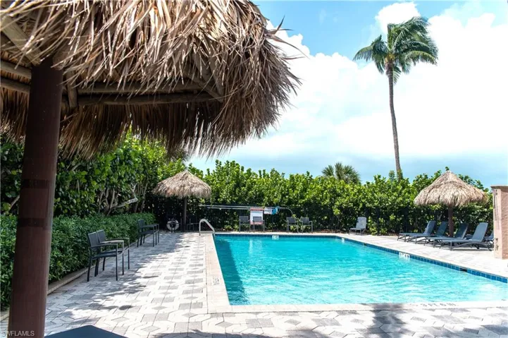 View of swimming pool with a gazebo and a patio area