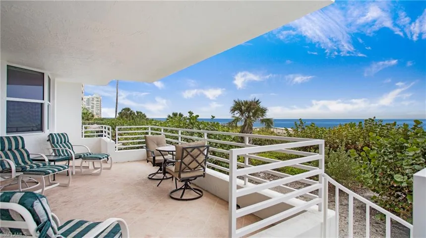 View of patio / terrace with a balcony and a water view