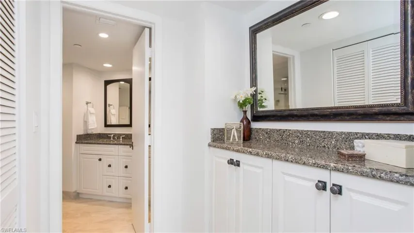Bathroom with vanity and tile patterned floors