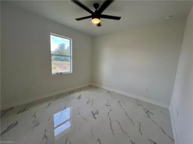 Primary bedroom with ceiling fan