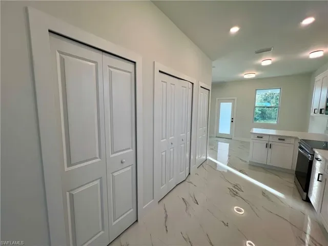 Kitchen featuring plenty of pantry space and laundry area