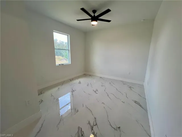 Primary bedroom featuring ceiling fan