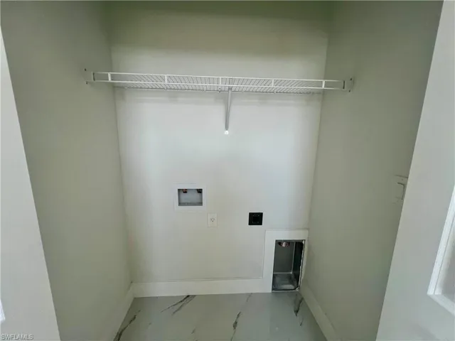 Laundry area featuring hookup for a washing machine and electric dryer hookup