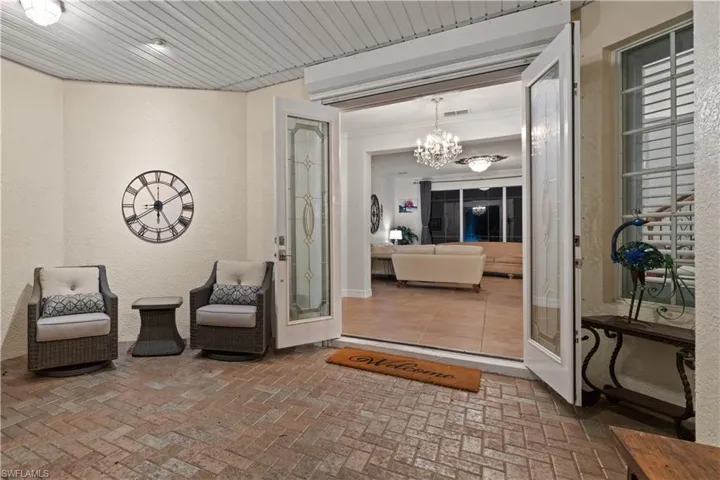 Now we are entering from the front door - featuring a beautiful seating section.