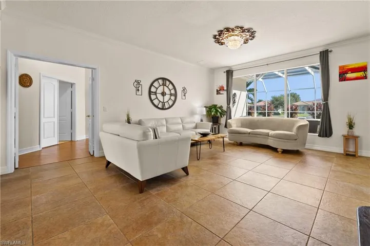 Spacious Living room picture showing beautiful views already, also the lighting and inviting flooring.