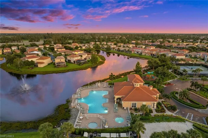 Aerial view at dusk featuring the Community Pool and Clubhouse