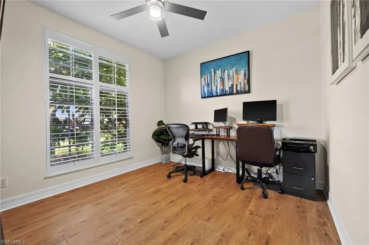 Office space featuring light hardwood / wood-style flooring and ceiling fan