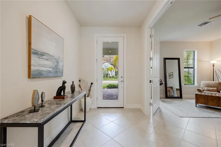 Entryway featuring light tile patterned flooring