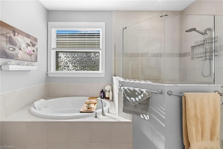 Bathroom featuring independent shower and bath