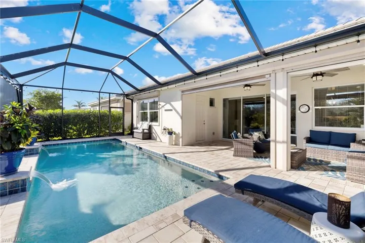 View of swimming pool featuring an outdoor hangout area, a lanai, pool water feature, ceiling fan, and a patio