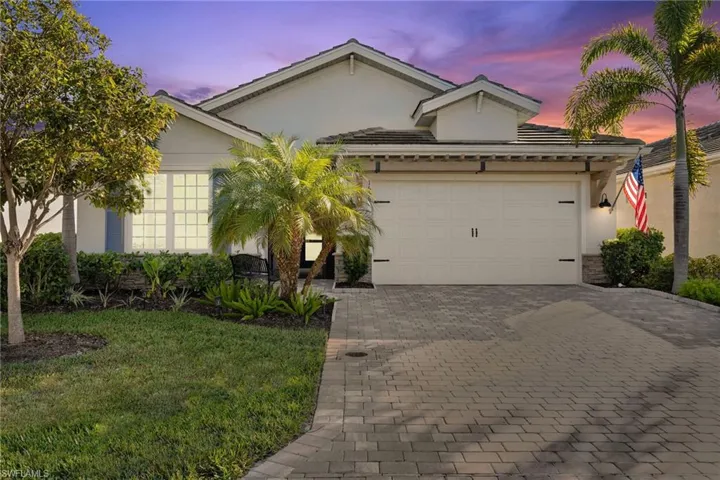 View of front of property featuring a garage