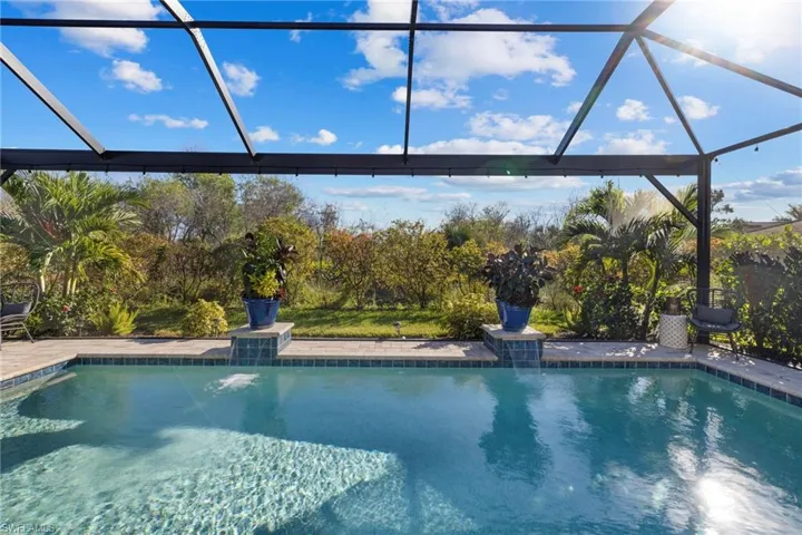 View of pool featuring a lanai