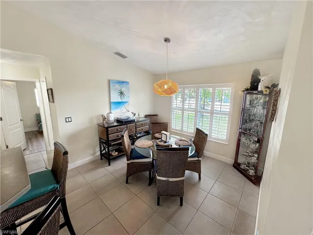 Dining room with light tile patterned floors