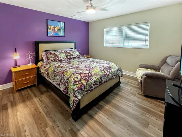 Bedroom with wood finished floors and a ceiling fan