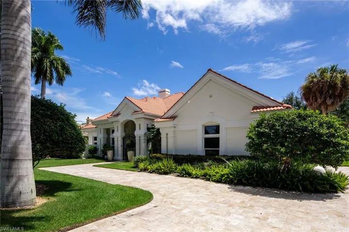 Mediterranean / spanish house featuring a front lawn