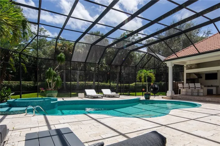 View of pool featuring a patio area and a lanai