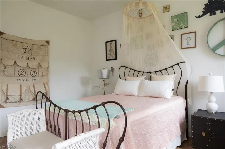 Bedroom with hardwood / wood-style floors