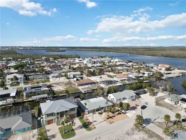 Drone / aerial view featuring a water view and a residential view