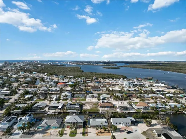 Aerial view featuring a water view and a residential view