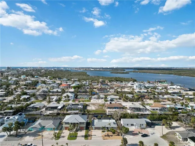 Drone / aerial view featuring a water view and a residential view