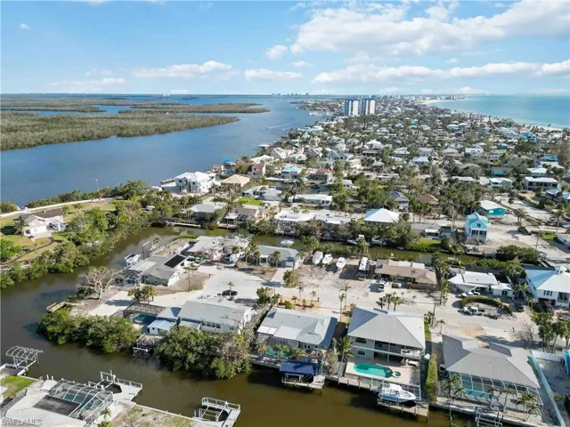 Drone / aerial view with a water view and a residential view