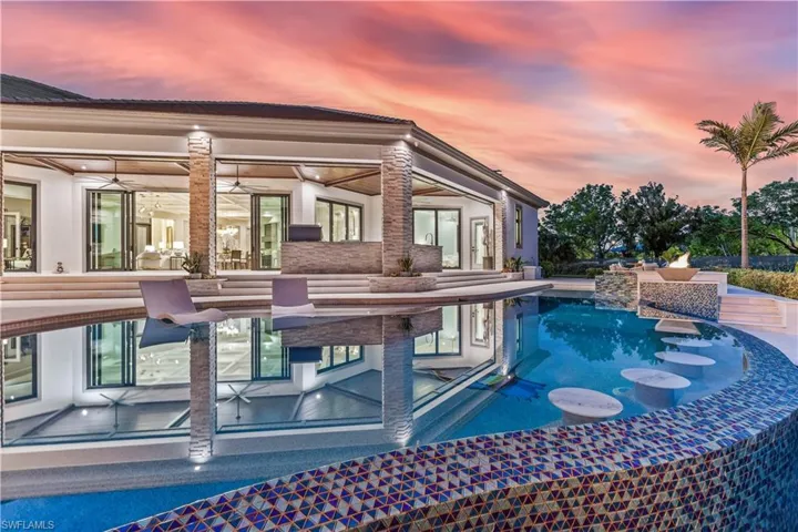 View of pool at dusk