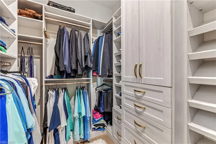 Walk in closet featuring wood-type flooring