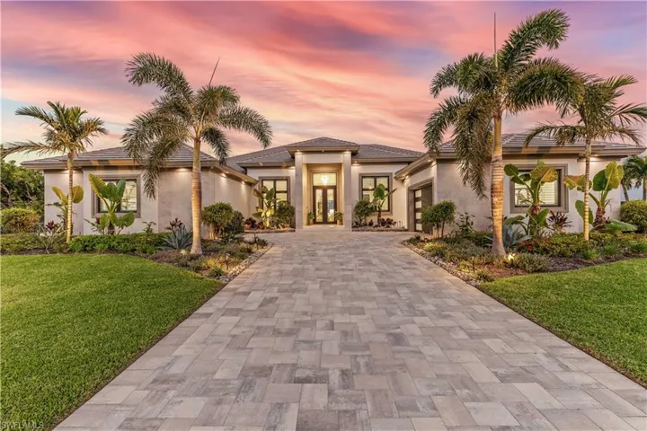 View of front of property featuring a lawn
