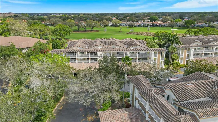 Aerial perspective of suburban area with a local golf course