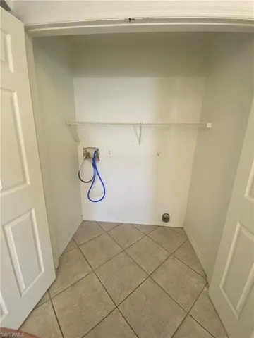 Large interior Laundry closet - fits full size washer/dryer and has additional storage shelving.