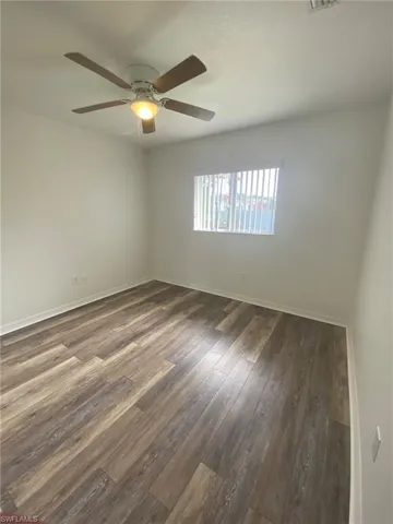 Front Guest bedroom with ceiling fan and LVP floor