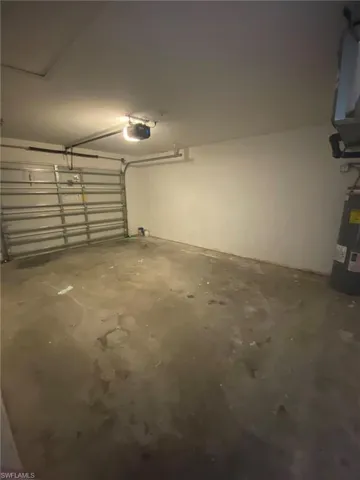 One car garage with Garage door opener.
