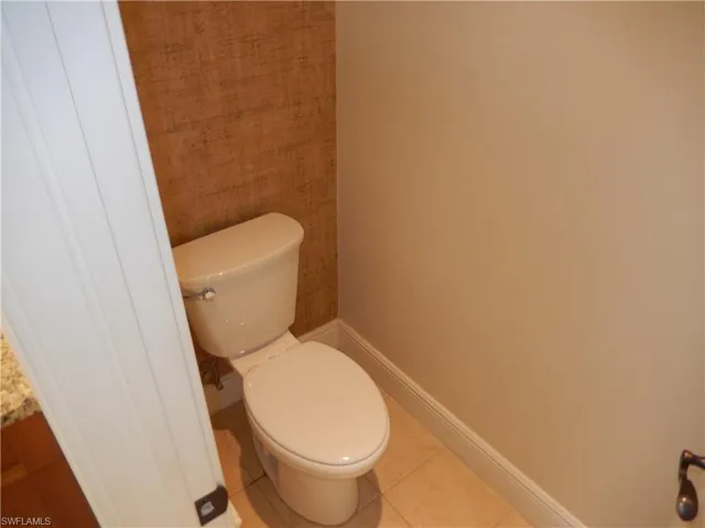 Bathroom featuring baseboards and tile patterned floors
