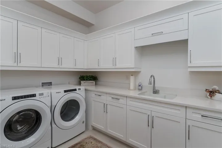 Laundry room with extra storage and Quartz counters.