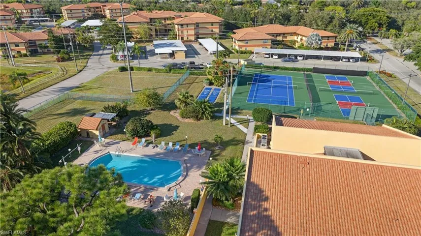 Aerial view of residential area featuring a pool area