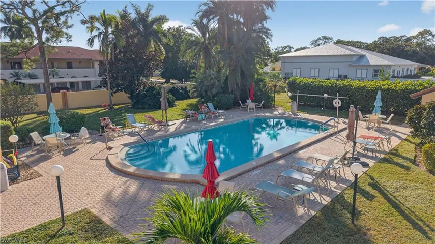 Community pool featuring a patio area