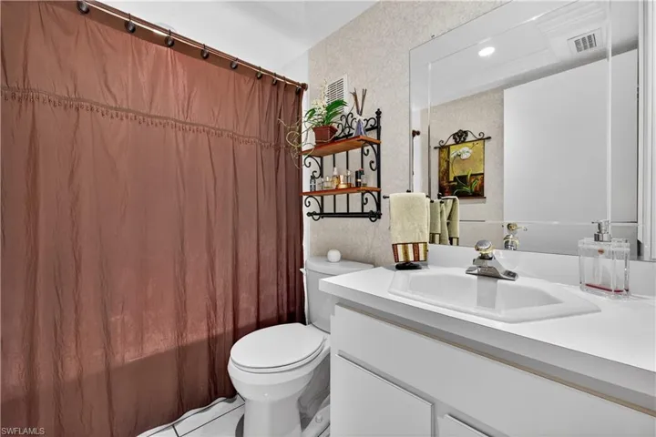 Full bathroom featuring vanity and toilet