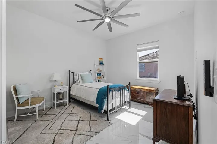 Bedroom featuring ceiling fan