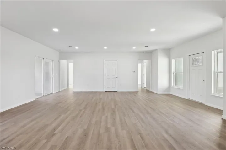 Unfurnished living room featuring light hardwood / wood-style floors