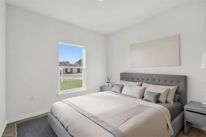 Bedroom with hardwood / wood-style floors