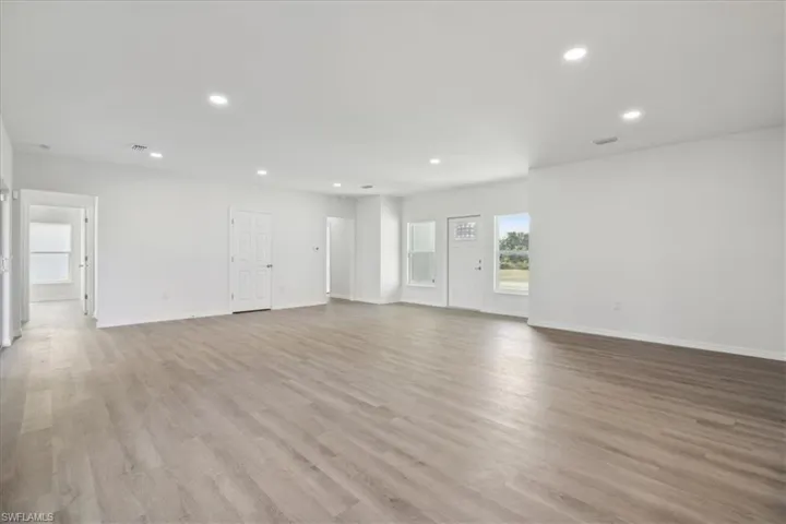 Unfurnished room featuring light wood-type flooring