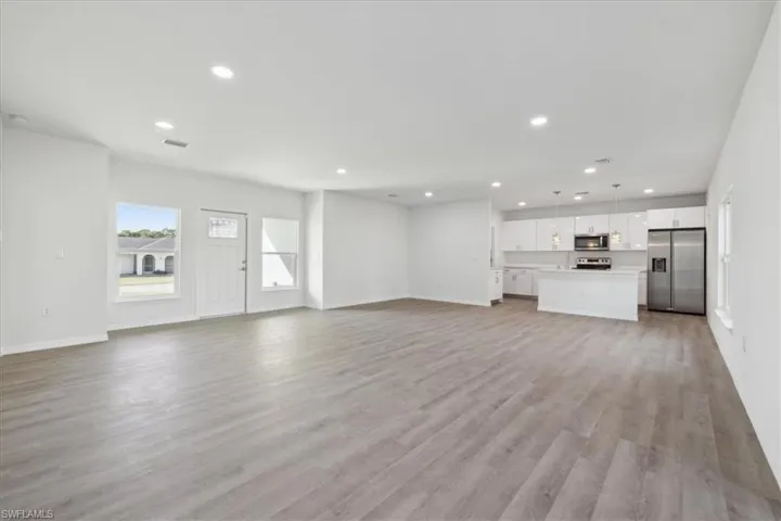 Unfurnished living room with light hardwood / wood-style flooring