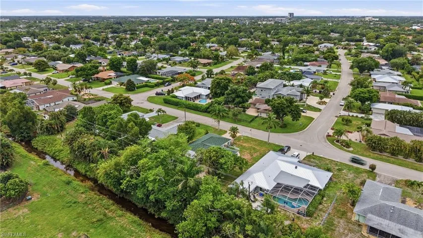 Aerial perspective showcasing a residential neighborhood with verdant landscaping