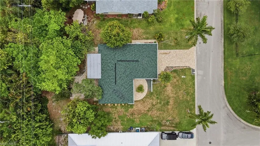 Single-story residence with a dark green shingle roof