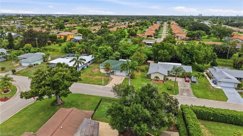 Aerial perspective showcasing a residential neighborhood with numerous single-story homes