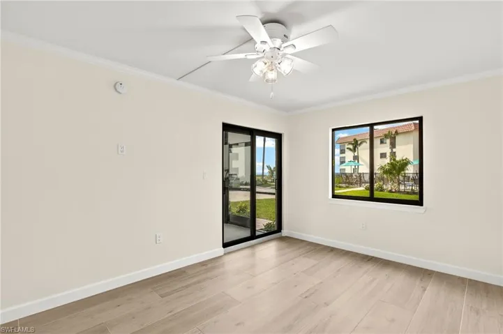 Primary Bedroom w/Doorway to Relaxing Lanai