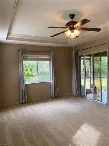 Priamry bedroom with slider to the lanai. There are 2 walk-in closets.