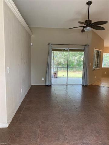 Looking from the front door towards the lanai slider. The Primary bedroom is immediately to the left.