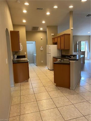 Laundry room off the kitchen leads to the garage